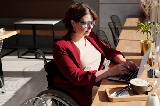 a young professional enjoying a coffee while working