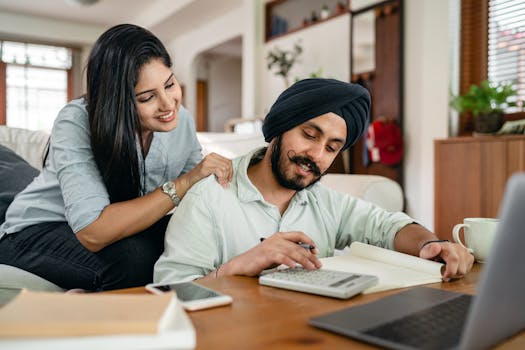 happy young couple reviewing their finances