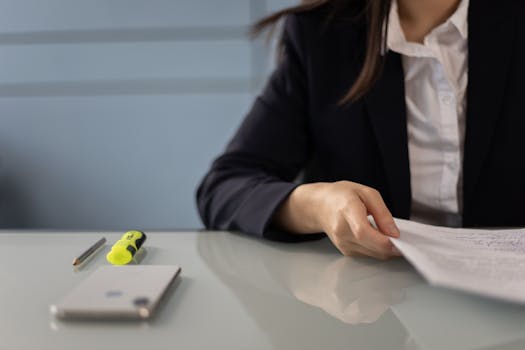 person reviewing financial statements at a desk