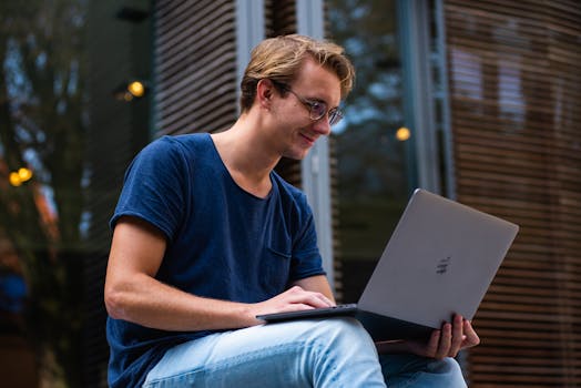 a young professional working on a laptop