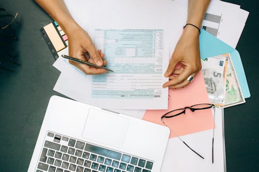 person reviewing their financial plan on a laptop